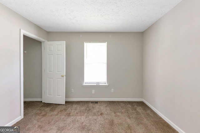 400 Rustin Dr, Dallas, GA 30157 - spare room with carpet and a textured ceiling