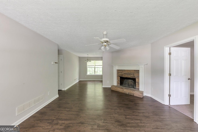 400 Rustin Dr, Dallas, GA 30157 - unfurnished living room with ceiling fan, dark wood finished floors, a fireplace, and a textured ceiling