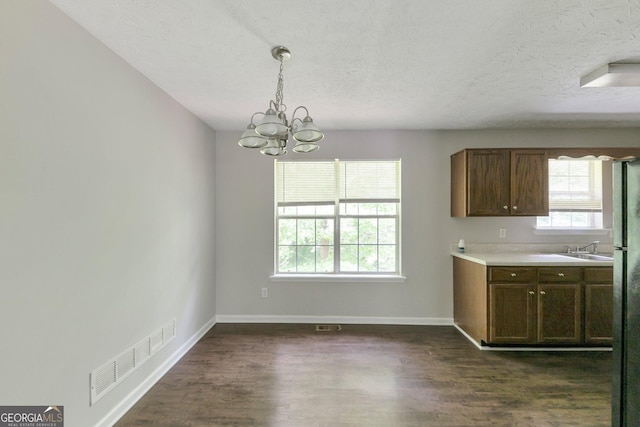 400 Rustin Dr, Dallas, GA 30157 - kitchen featuring a chandelier, a textured ceiling, dark wood finished floors, pendant lighting, and light countertops