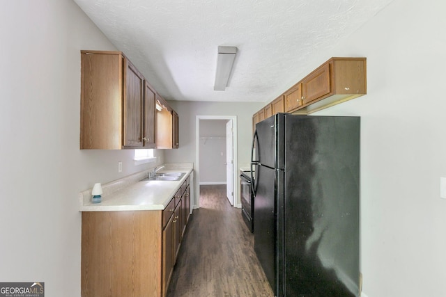 400 Rustin Dr, Dallas, GA 30157 - kitchen featuring black appliances, dark wood-style flooring, light countertops, brown cabinets, and a textured ceiling