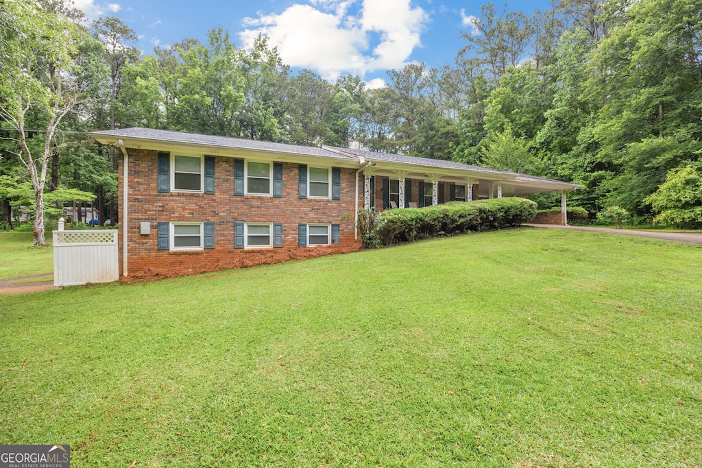695 Hiram Sudie Rd, Dallas, GA 30157 - view of front of property featuring a front yard, brick siding, and a carport