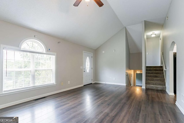 962 Taylors Farm Ct, Canton, GA 30115 - unfurnished living room with ceiling fan, vaulted ceiling, wood finished floors, stairs, and arched walkways