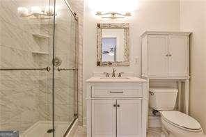 791 Wylie St SE Unit 404, Atlanta, GA 30316 - bathroom with vanity and a stall shower