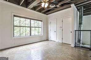 791 Wylie St SE Unit 404, Atlanta, GA 30316 - spare room with ceiling fan and concrete flooring