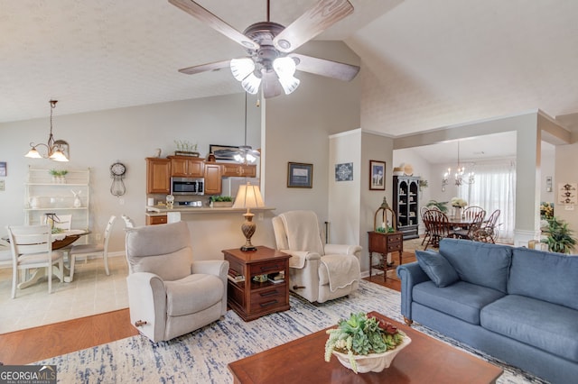 253 Lakeview Bend Cir, Jefferson, GA 30549 - living area featuring light wood-style floors, a chandelier, a ceiling fan, and high vaulted ceiling