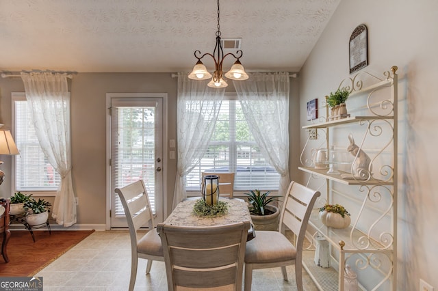 253 Lakeview Bend Cir, Jefferson, GA 30549 - dining area featuring healthy amount of natural light, a chandelier, and a textured ceiling