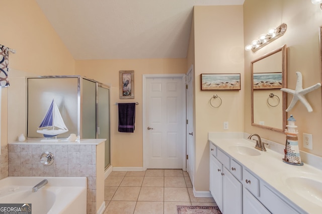 253 Lakeview Bend Cir, Jefferson, GA 30549 - full bath featuring tile patterned floors, a bath, double vanity, a shower stall, and lofted ceiling