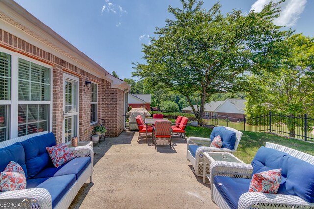 253 Lakeview Bend Cir, Jefferson, GA 30549 - fenced backyard with an outdoor living space, a patio, and outdoor dining space
