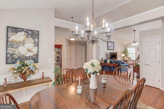 253 Lakeview Bend Cir, Jefferson, GA 30549 - dining space with wood finished floors, ceiling fan, lofted ceiling, crown molding, and a chandelier