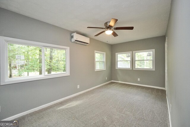 118 Turtle Cove Trwy, Monticello, GA 31064 - empty room featuring a wall unit AC, ceiling fan, and carpet