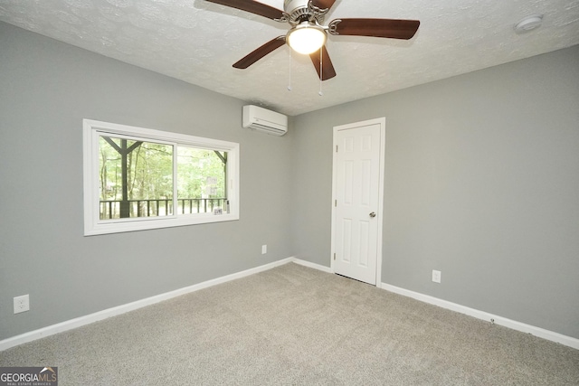 118 Turtle Cove Trwy, Monticello, GA 31064 - spare room featuring a wall unit AC, a smoke detector, carpet flooring, a textured ceiling, and a ceiling fan