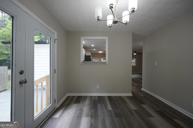 118 Turtle Cove Trwy, Monticello, GA 31064 - unfurnished dining area with a chandelier, wood finished floors, a textured ceiling, and a ceiling fan
