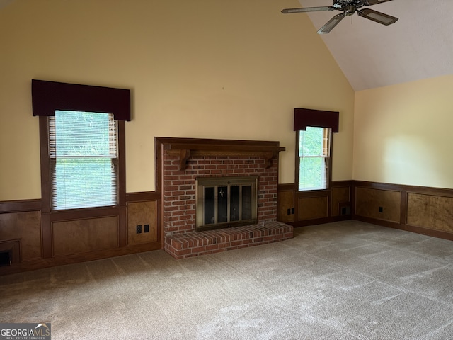 25 Darcee Ct, Lawrenceville, GA 30046 - unfurnished living room featuring a wainscoted wall, a brick fireplace, carpet, a ceiling fan, and high vaulted ceiling
