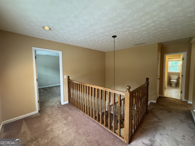 25 Darcee Ct, Lawrenceville, GA 30046 - hall with an upstairs landing, carpet floors, and a textured ceiling
