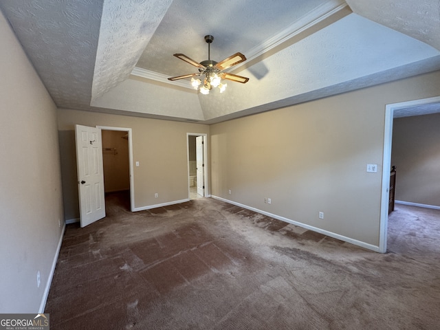 25 Darcee Ct, Lawrenceville, GA 30046 - unfurnished bedroom with a raised ceiling, carpet floors, a textured ceiling, a walk in closet, and a ceiling fan