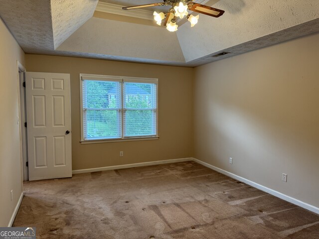 25 Darcee Ct, Lawrenceville, GA 30046 - empty room featuring a ceiling fan, carpet flooring, a raised ceiling, and a textured ceiling