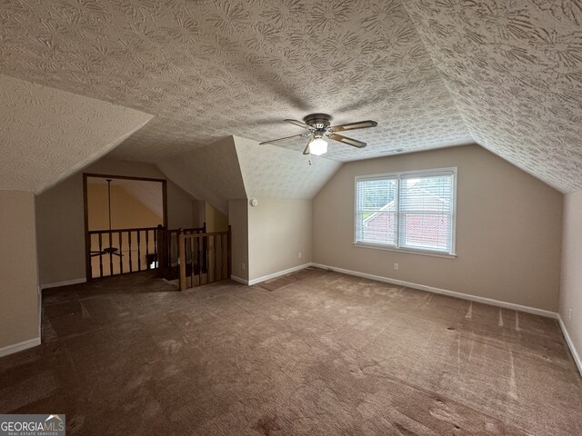 25 Darcee Ct, Lawrenceville, GA 30046 - additional living space with carpet, ceiling fan, and lofted ceiling