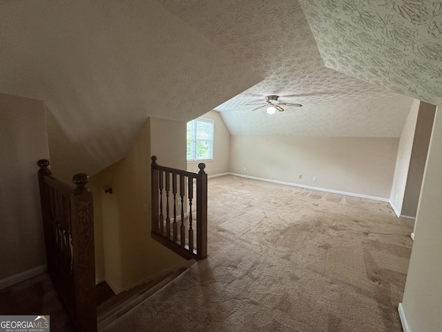 25 Darcee Ct, Lawrenceville, GA 30046 - additional living space with a textured ceiling, lofted ceiling, carpet flooring, and a ceiling fan