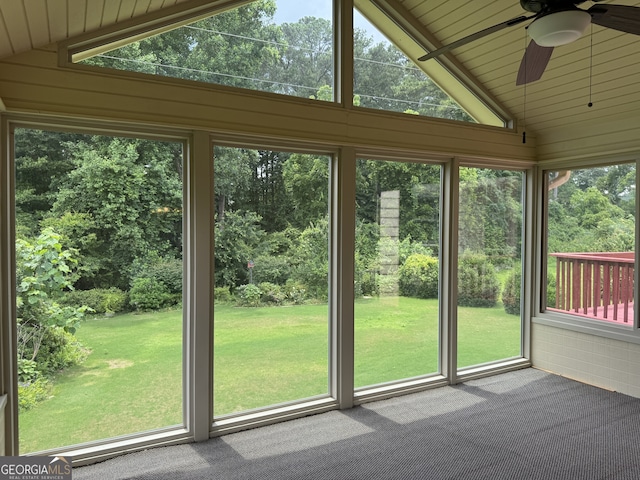 25 Darcee Ct, Lawrenceville, GA 30046 - unfurnished sunroom with lofted ceiling, a ceiling fan, healthy amount of natural light, and view of wooded area