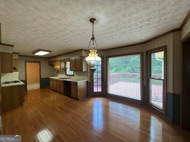25 Darcee Ct, Lawrenceville, GA 30046 - kitchen with dishwasher, light countertops, dark wood finished floors, crown molding, and wallpapered walls