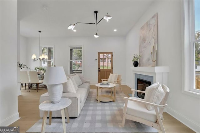826 Gaston St SW, Atlanta, GA 30310 - living room with a chandelier, a fireplace, light wood-style flooring, and recessed lighting