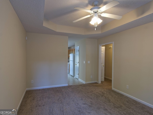 13 Pine Shadow Ct, Centerville, GA 31028 - unfurnished room featuring carpet floors, a ceiling fan, a raised ceiling, and a textured ceiling