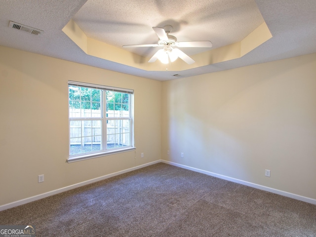 13 Pine Shadow Ct, Centerville, GA 31028 - carpeted spare room with a textured ceiling, ceiling fan, and a raised ceiling