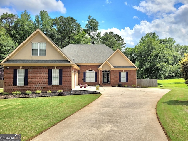 223 Overland Trl, Mcdonough, GA 30252 - view of front of property featuring brick siding, concrete driveway, roof with shingles, stucco siding, and view of wooded area
