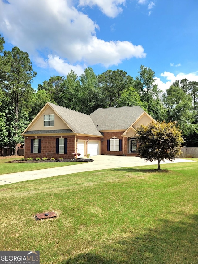 223 Overland Trl, Mcdonough, GA 30252 - view of front facade featuring an attached garage, driveway, brick siding, and view of scattered trees