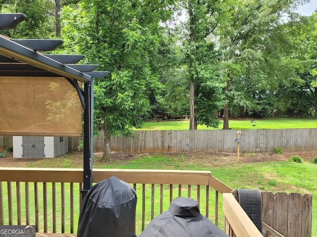 223 Overland Trl, Mcdonough, GA 30252 - deck with a storage shed, a fenced backyard, and area for grilling