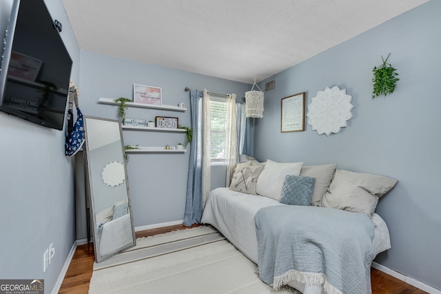 2716 Meadow Ridge Dr NW, Duluth, GA 30096 - bedroom with wood finished floors and baseboards