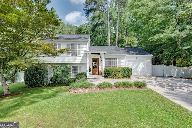 2716 Meadow Ridge Dr NW, Duluth, GA 30096 - tri-level home featuring an attached garage and driveway