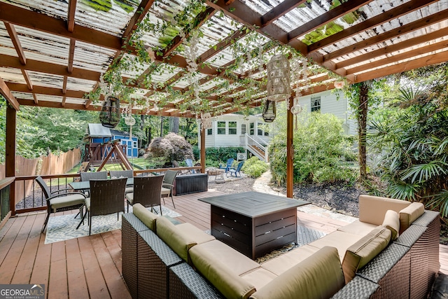2716 Meadow Ridge Dr NW, Duluth, GA 30096 - wooden terrace with an outdoor living space with a fire pit, outdoor dining space, and a playground