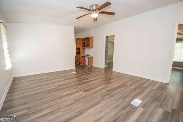 381 Jim Turner Rd, West Point, GA 31833 - unfurnished living room with a ceiling fan and wood finished floors