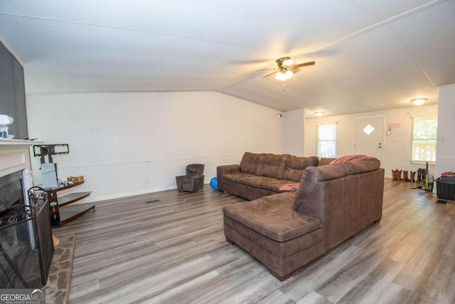 381 Jim Turner Rd, West Point, GA 31833 - living area with a ceiling fan, wood finished floors, a fireplace, healthy amount of natural light, and lofted ceiling