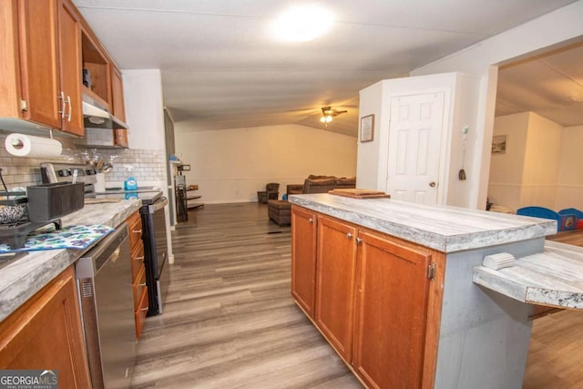 381 Jim Turner Rd, West Point, GA 31833 - kitchen with stainless steel appliances, under cabinet range hood, open floor plan, light wood-style floors, and a ceiling fan