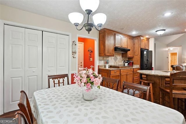 408 Victoria Place Dr, Locust Grove, GA 30248 - dining area with a textured ceiling, a chandelier, recessed lighting, and lofted ceiling