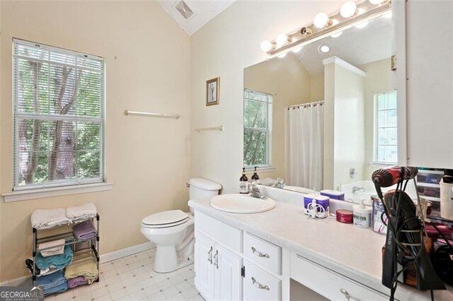 408 Victoria Place Dr, Locust Grove, GA 30248 - full bath with vaulted ceiling, plenty of natural light, vanity, tile patterned floors, and a shower with curtain