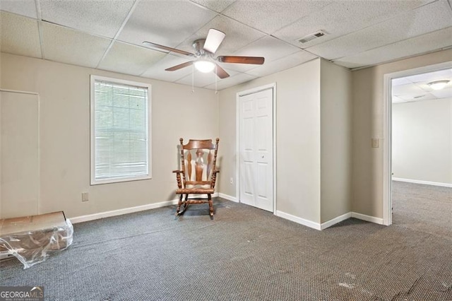 408 Victoria Place Dr, Locust Grove, GA 30248 - living area with a paneled ceiling, ceiling fan, and carpet flooring