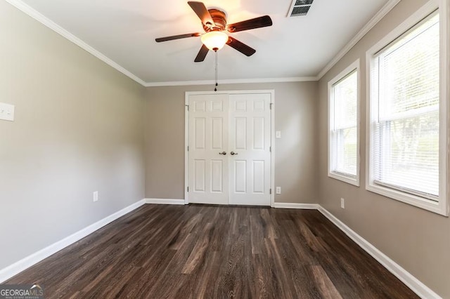 3993 Forrest Ct, Atlanta, GA 30341 - unfurnished bedroom featuring dark wood-style floors, a closet, ornamental molding, and ceiling fan