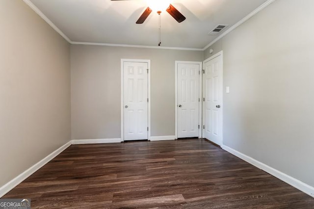 3993 Forrest Ct, Atlanta, GA 30341 - unfurnished bedroom with dark wood finished floors, ornamental molding, multiple closets, and ceiling fan