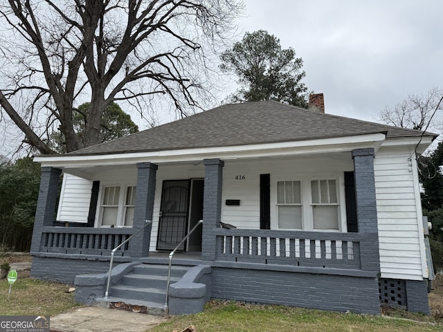 416 Middle St, Macon, GA 31201 - view of front of home with covered porch, a chimney, and a shingled roof