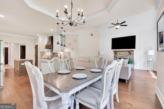 35 Cornish Creek Ln, Covington, GA 30014 - dining area featuring ceiling fan, wood finished floors, crown molding, a chandelier, and recessed lighting