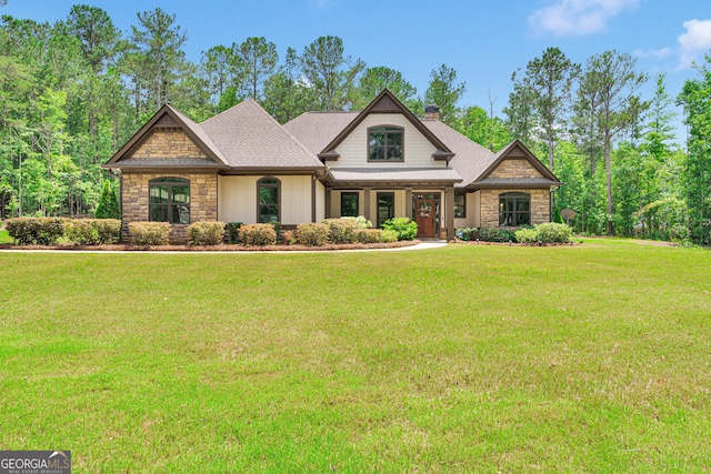 35 Cornish Creek Ln, Covington, GA 30014 - craftsman-style home with stone siding, a chimney, and a front lawn