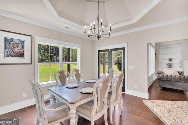 35 Cornish Creek Ln, Covington, GA 30014 - dining area with a chandelier, a tray ceiling, dark wood-type flooring, french doors, and ornamental molding