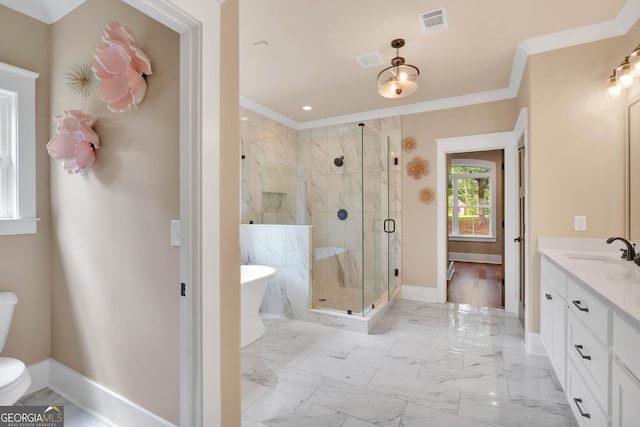 35 Cornish Creek Ln, Covington, GA 30014 - bathroom with a freestanding tub, vanity, a shower stall, crown molding, and marble look tiles
