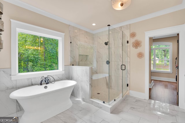 35 Cornish Creek Ln, Covington, GA 30014 - bathroom with a freestanding bath, a marble finish shower, tile walls, and marble finish floors
