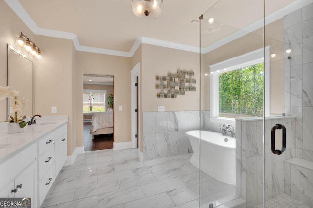 35 Cornish Creek Ln, Covington, GA 30014 - ensuite bathroom with a soaking tub, double vanity, a marble finish shower, crown molding, and wainscoting