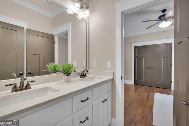 35 Cornish Creek Ln, Covington, GA 30014 - full bath with double vanity, a ceiling fan, and wood finished floors