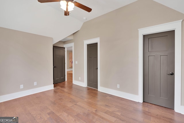 35 Cornish Creek Ln, Covington, GA 30014 - empty room featuring lofted ceiling, ceiling fan, and wood finished floors